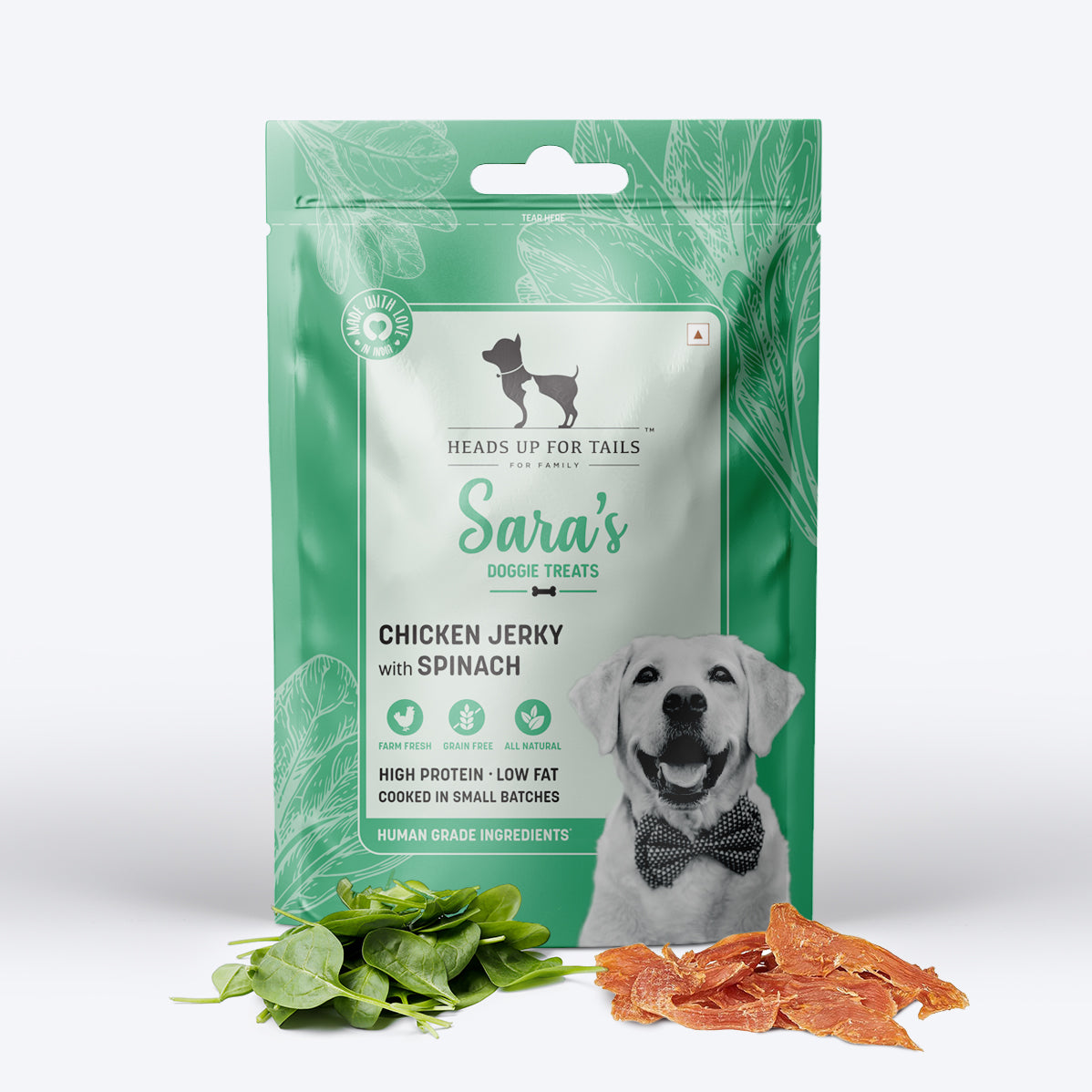 Sara's Doggie Treats Chicken Jerky with Spinach, 70 g, featuring a green packaging and images of spinach and jerky pieces.